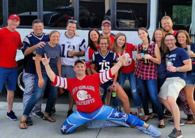 Patriots fans in front of party bus